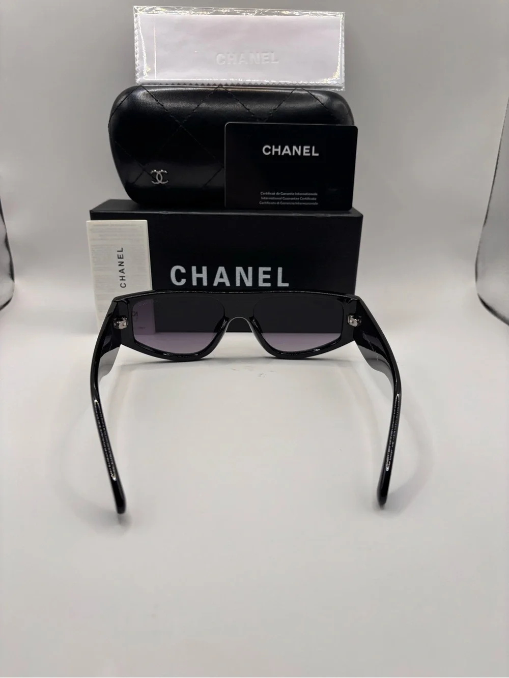 CHANEL Black Shield Sunglasses with Purple Gradient Lenses